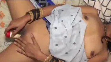 Indian desi sex Bhabhi using a large dildo to massage Chut